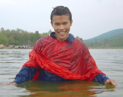 Poncho swimming in a lake